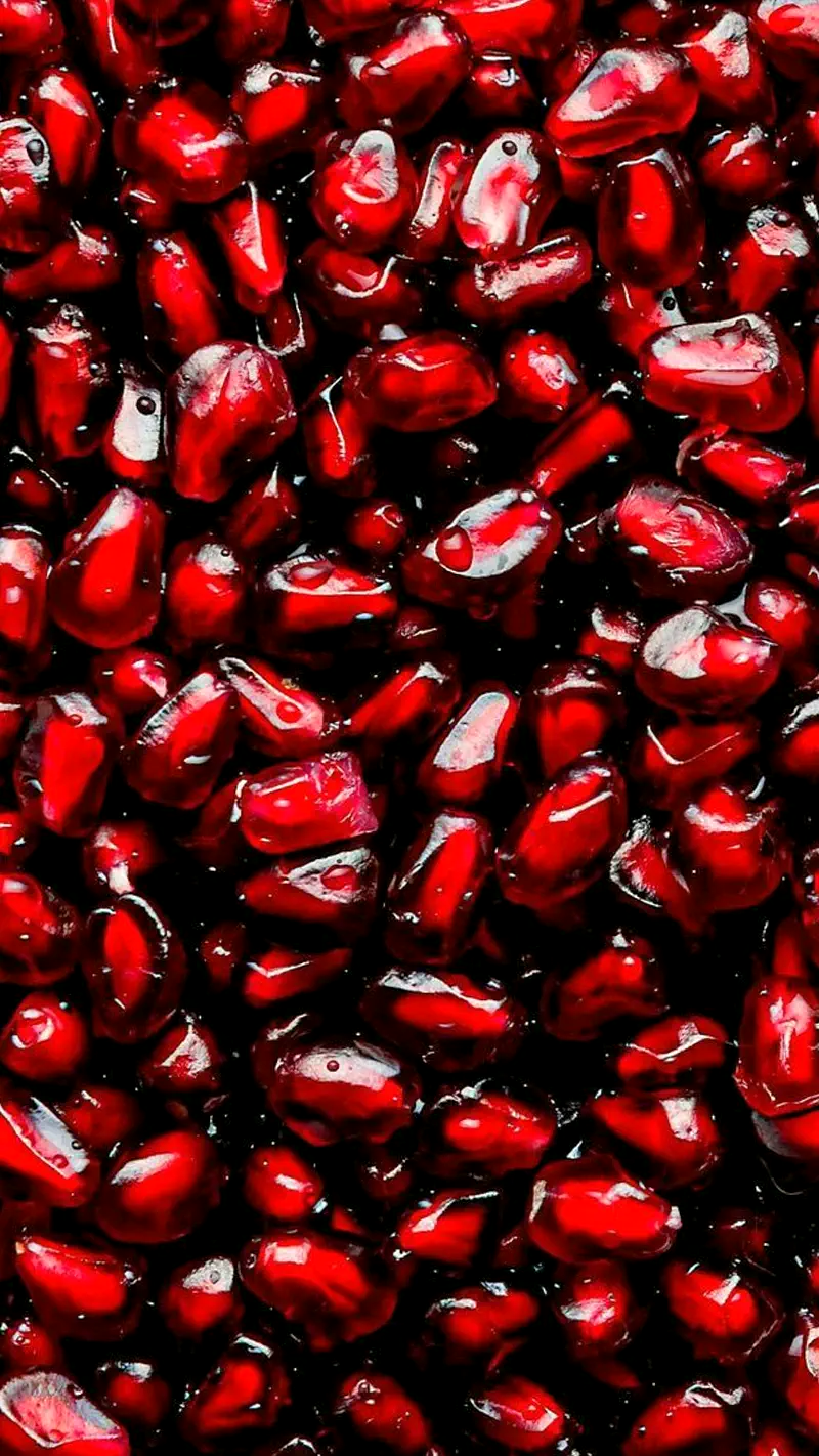 Close-up of glossy pomegranate arils